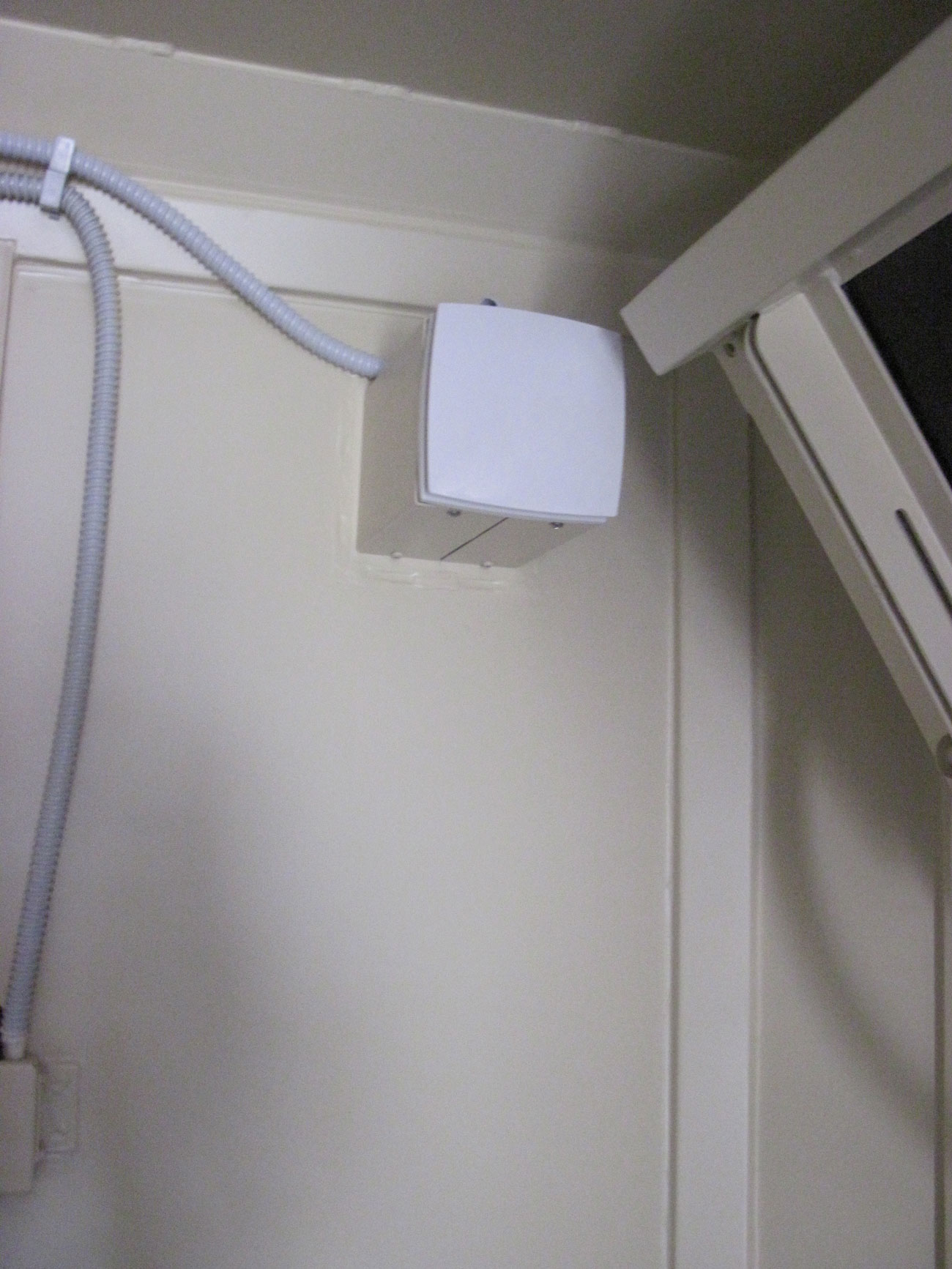 Protected airtight door of a mobile shelter in the open position.
